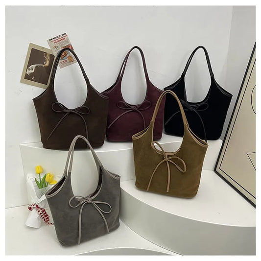 Clsaine | Schultertasche mit Schleifendetail